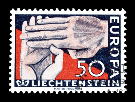 Cancelled postage stamp printed by Liechtenstein, that shows Hands, circa 1962.のeditorial素材