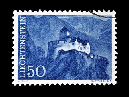Cancelled postage stamp printed by Liechtenstein, that shows Vaduz castle, circa 1959.のeditorial素材