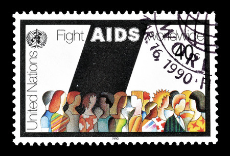 Cancelled postage stamp printed by United Nations, that promotes Fight against AIDS, circa 1990.のeditorial素材