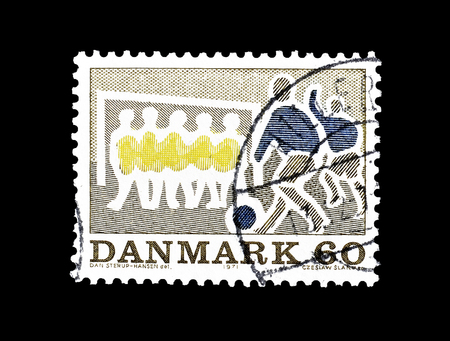 Cancelled postage stamp printed by Denmark, that shows football players, circa 1971.のeditorial素材