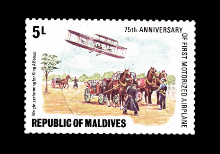 Cancelled postage stamp printed by Maldives, that shows Wilbur Wright showing his plane to King Alfonso of Spain, circa 1978.のeditorial素材