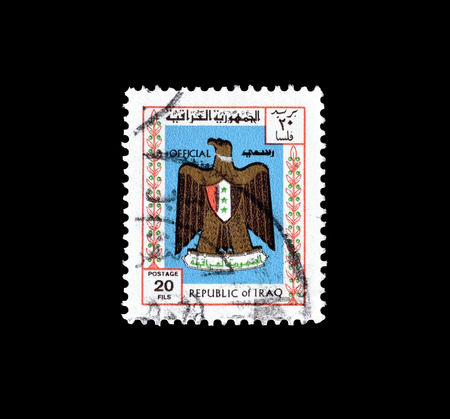 Cancelled postage stamp, printed by Iraq, that shows Arms of Iraq, circa 1975.のeditorial素材