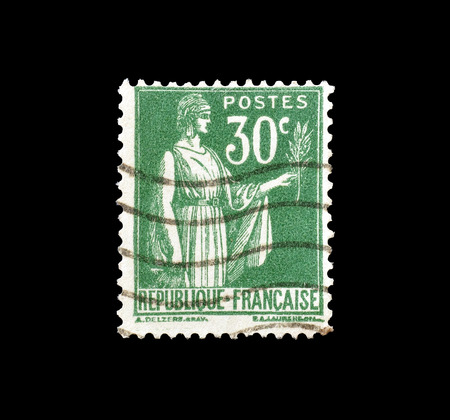 Cancelled postage stamp printed by France, that shows Allegory of Peace, circa 1933.のeditorial素材