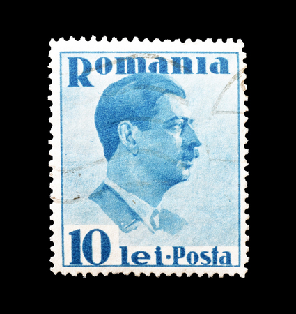 Cancelled postage stamp printed by Romania, that shows King Karl, circa 1936.