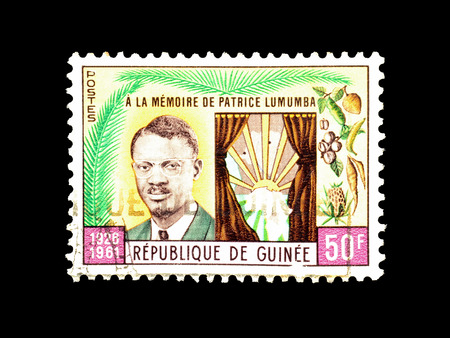 Cancelled postage stamp printed by Guinea, that shows Patrice Lumumba, circa 1962.のeditorial素材