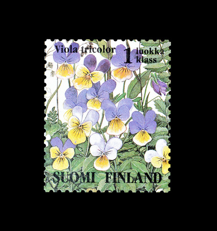 Cancelled postage stamp printed by Finland, that shows Heartsease flower, circa 1994.のeditorial素材