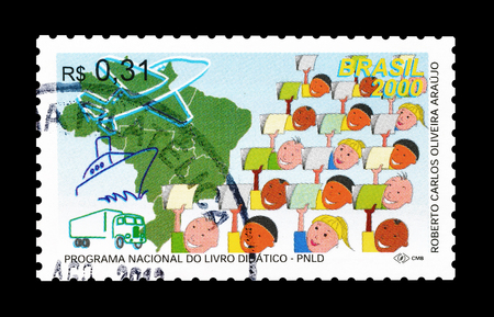 Cancelled postage stamp printed by Brazil, that promotes National textbook program, circa 2000.のeditorial素材