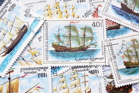 Cancelled postage stamps printed by Republic Sahrawi and Cambodia, that shows ancient sailing ships.の写真素材
