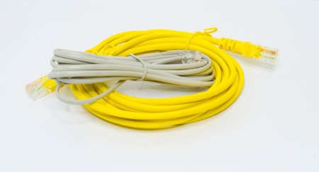 Gray and yellow computer and telephone cables