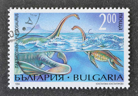 Cancelled postage stamp printed by Bulgaria, that shows Plesiosaurus, circa 1994.のeditorial素材