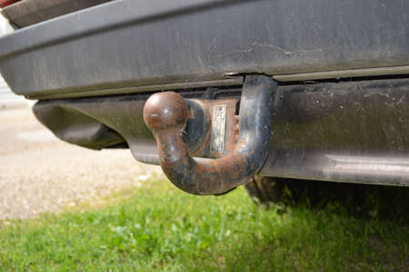 Vintage rusted car hook with spider web around