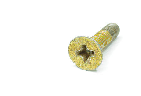 Old metal screw with square head on white backgroundの写真素材