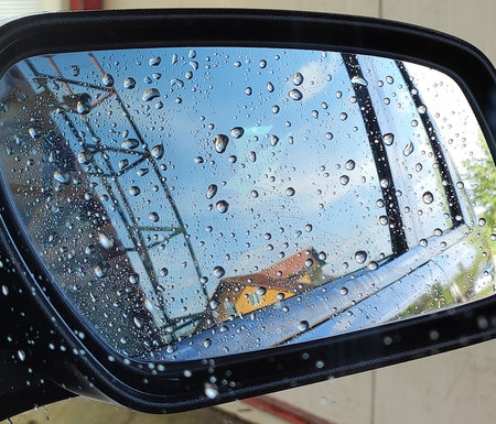 Rain drops on a side door mirror after the rainの写真素材
