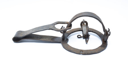 Old rusted metal trap for catching small wild animalsの写真素材