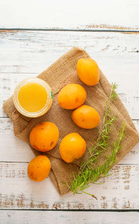 Raw apricot and honey to make a delicious sweet recipeの写真素材