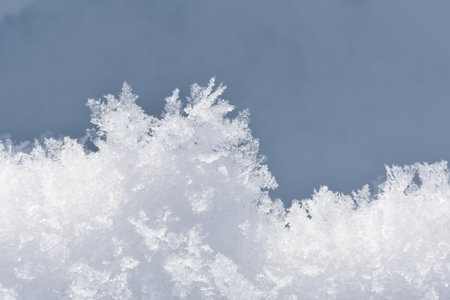 Snowflakes on a background of blue sky close-up