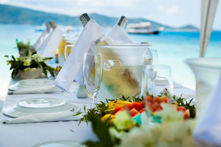 Table setting for an event party or wedding reception at the beachの写真素材