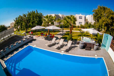 Swimming pool in an open-air mansion.の写真素材