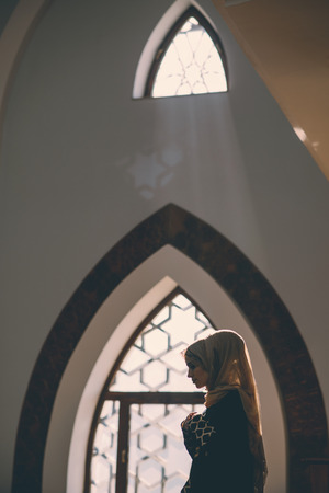 Muslim girl praying in peaceの写真素材