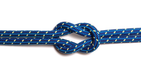Reef knot made of two blue-yellow hawsers, isolated