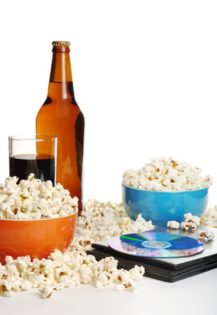 Movie night at home: Popcorn, softdrink, beer and DVDの写真素材