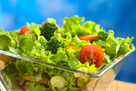 Fresh vegetable salad made of tomato, broccoli, corn, yellow bell pepper and lettuce の写真素材
