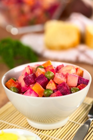 Russian beetroot salad made of beetroot, potato, carrot, pea and a mayonnaise dressing (Selective Focus, Focus on the top of the vegetables in the middle) の写真素材