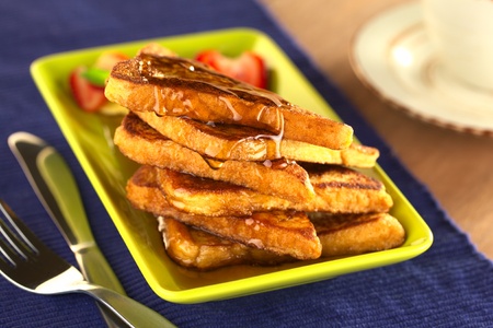 French toast with maple syrup (Selective Focus, Focus on the front of the upper slice) の写真素材