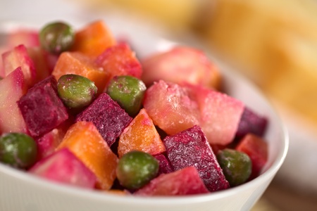 Russian beetroot salad made of beetroot, potato, carrot, pea and a mayonnaise dressing (Selective Focus, Focus one third into the bowl) の写真素材