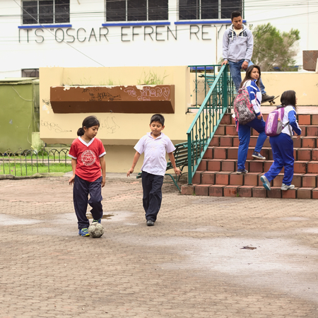 BANOS, ECUADOR - FEBRUARY 25, 2014  Unidentified children playing football in Sebastian Acosta Park on February 25, 2014 in Banos, Ecuador  のeditorial素材