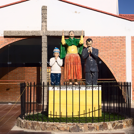 COPACABANA, BOLIVIA - OCTOBER 19, 2014: Statues and cross outside the Velatorio (Chapel of Rest) in the small tourist town along Lake Titicaca on October 19, 2014 in Copacabana, Boliviaのeditorial素材