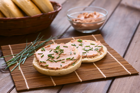 Liverwurst spread on bun with chives photographed with natural light の写真素材