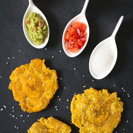 Patacon or toston, fried and flattened pieces of green plantains, a traditional snack or...