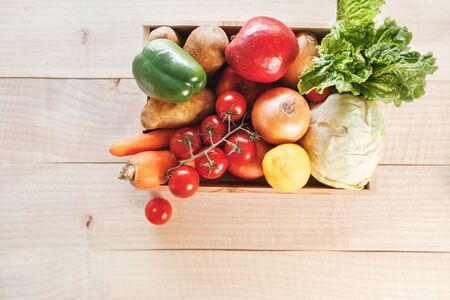 Fresh produce delivery box on wooden backgroundの写真素材