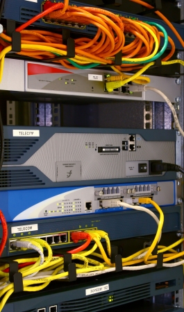networking rack in datacenter with routers