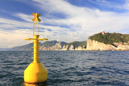floating yellow buoy on mediterranean coast in front of portovenere, la spezia, italyの写真素材