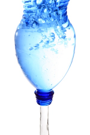 pouring water from a plastic bottleの写真素材