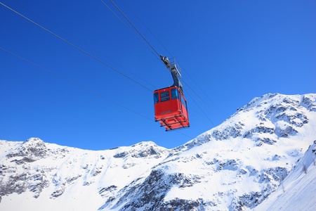 Red cable car railway, cableway, in ski resort の写真素材