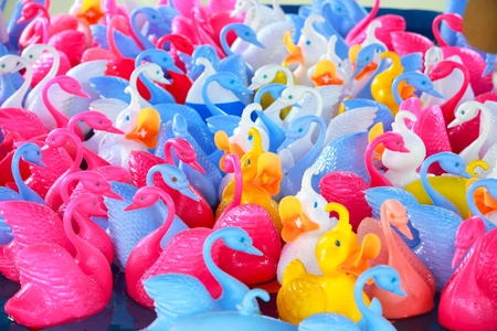 colorful plastic toy ducklings in amusement park