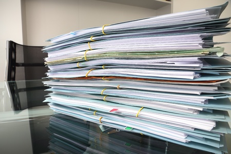 file stack on office desk