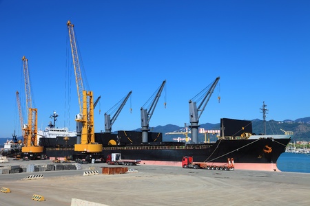 ship and trucks in harbor