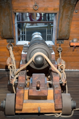 old cannon on wooden deck of galleonの写真素材