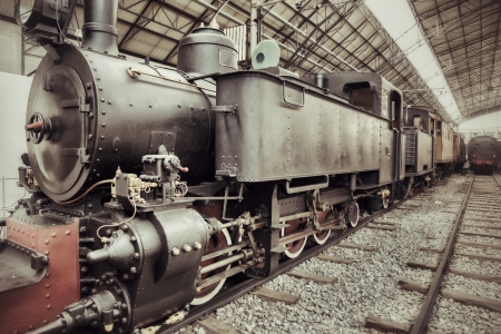 Old retro steam train locomotive in station