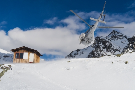 Helicopter mountain rescue service in winter, on italian alpsの写真素材