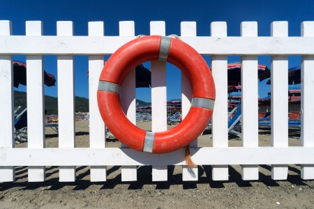 Lifebuoy attached to a white wooden fenceのeditorial素材