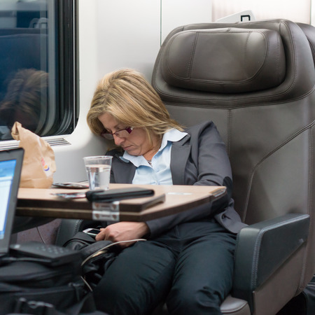 26 march 2014 - commuter sleeping on high speed trainのeditorial素材