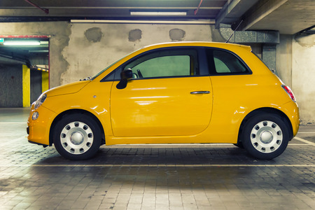 small car in undergroud parking grunge tonedの写真素材