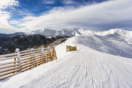 high mountain slope with fresh snowの写真素材