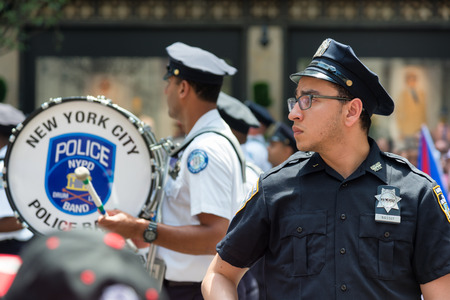 NEW YORK CITY - JUNE 14, 2015: Yellow cabs in Broadway, a busy tourist intersection of commerce Advertisements and theaters. One of the most famous streets of New York City and USのeditorial素材