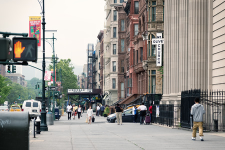 NEW YORK, USA - JUNE 16, 2015: Malcolm X Boulevard in Harlem district. Harlem is a large neighborhood within the northern section of the New York City borough of Manhattan, known as a major African American residential, cultural and business center.のeditorial素材